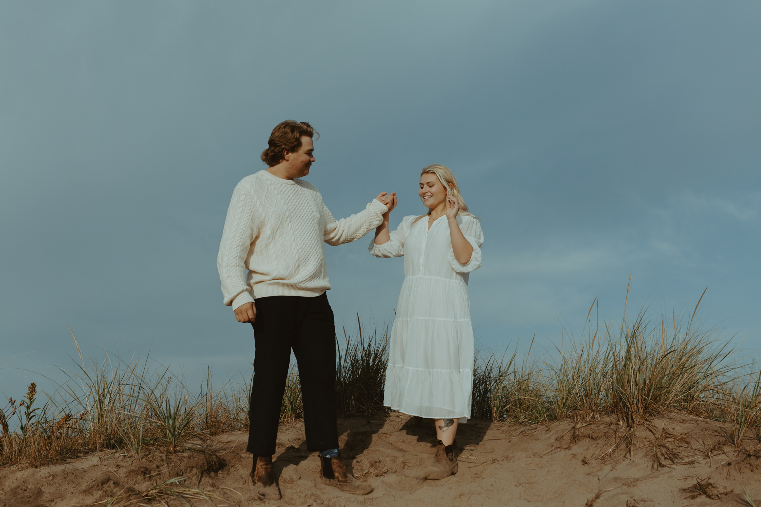 couples dancing during sunrise engagement in lawrencetown