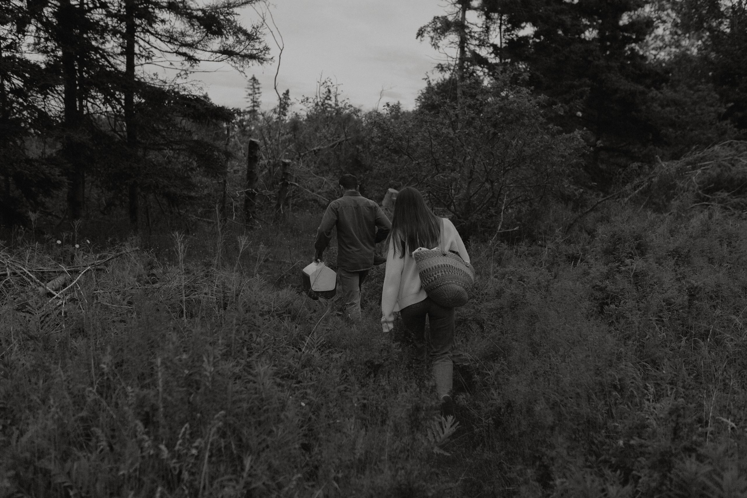 couples walking Thomas cove trail black and white engagement